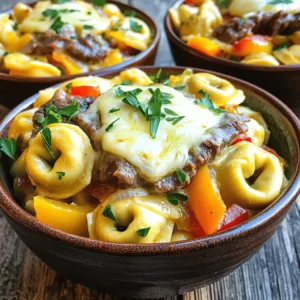 - Cheese tortellini - Ribeye steak - Onion and bell pepper - Garlic and provolone cheese Let's start with the main ingredients. Cheese tortellini is the star of this dish. You can use fresh or frozen tortellini; both work well. Ribeye steak adds a rich and savory flavor. Thinly slice it for the best texture. Next, we have onion and bell pepper. They add sweetness and crunch. Lastly, garlic and provolone cheese bring the dish together. Garlic adds depth, and provolone gives that creamy finish. - Olive oil - Worcestershire sauce - Salt and pepper Now, let’s talk about pantry essentials. Olive oil is key for cooking the steak and veggies. It adds a nice flavor. Worcestershire sauce gives a savory kick. It enhances the steak's taste. Don't forget salt and pepper. They are simple but essential for seasoning. - Fresh parsley - Crushed red pepper flakes Garnishes can elevate your dish. Fresh parsley adds color and freshness. A sprinkle of crushed red pepper flakes brings heat. You can adjust the amount based on your spice level. If you want to explore more, check out the Full Recipe for additional ideas. - First, boil a large pot of salted water. - Add 12 ounces of cheese tortellini to the boiling water. - Cook according to the package instructions, usually about 3-5 minutes. - Drain the tortellini and set it aside for later. - Heat 2 tablespoons of olive oil in a large skillet over medium heat. - Add 1 medium onion and 1 medium bell pepper, both sliced. - Sauté for 5-7 minutes until the onion is soft and clear. - Add 2 cloves of minced garlic and cook for 1 more minute. - In the same skillet, add 1 pound of thinly sliced ribeye steak. - Season the steak with salt, pepper, and 1 tablespoon of Worcestershire sauce. - Cook for about 3-4 minutes, stirring until the steak is nicely browned. - Return the sautéed vegetables to the skillet with the steak. - Add the cooked tortellini and mix everything well. - Heat for another 2-3 minutes until it’s all warm. - Remove the skillet from heat once everything is heated through. - Sprinkle 1 cup of shredded provolone cheese on top. - Cover the skillet for about 2 minutes to let the cheese melt. These steps will guide you to make a delicious Cheesesteak Tortellini. For more details, check the Full Recipe. - Ensuring steak is thinly sliced: Use a sharp knife. Freeze the ribeye for 30 minutes. This makes slicing easier. Aim for pieces about 1/4 inch thick. Thin slices cook faster and stay tender. - Preventing tortellini from overcooking: Follow the package instructions. Set a timer while they cook. Drain them as soon as they float. Overcooked tortellini can turn mushy. Keep them al dente for the best texture. - Choosing the right skillet: A large, heavy skillet works best. It heats evenly and holds heat well. Avoid overcrowding the pan. This allows the steak to brown properly. - Serving suggestions: Use wide bowls for a nice look. This lets you show off the colorful dish. Serve hot for the best taste. - Garnishing ideas: Sprinkle freshly chopped parsley on top. Add crushed red pepper flakes for a hint of heat. A drizzle of olive oil adds shine and flavor. - Enhancing flavor with additional toppings: Try adding sautéed mushrooms or jalapeños. These add a kick and depth. A sprinkle of extra cheese can make it richer. - Suggested side dishes: A simple side salad works well. Roasted vegetables are a great choice too. Garlic bread adds a nice touch. - Recommended wines to complement the dish: Pair with a light red wine like Pinot Noir. A chilled white like Sauvignon Blanc also works. Both enhance the dish's flavors. - Additional herbs and spices: Fresh basil or oregano can brighten the dish. A dash of smoked paprika adds warmth. Experiment with spices to find your favorite mix. {{image_2}} If you want to switch up the meat, try using chicken or turkey. They both cook quickly and absorb flavors well. For a vegetarian twist, mushrooms are a great option. They add a nice umami taste and a hearty texture. For a vegan version, look for cheese substitutes made from nuts or soy. These options keep the dish creamy while fitting dietary needs. For those avoiding gluten, gluten-free tortellini is widely available. You can also use different pasta shapes like penne or rigatoni. These shapes hold sauces well and offer a fun twist to the dish. Want to change the sauce? You can add a creamy sauce for a richer flavor. Marinara or Alfredo sauces also work great for a different taste. If you're craving some heat, throw in jalapeños or a dash of hot sauce. These additions elevate the dish and make it even more exciting. To keep your Cheesesteak Tortellini fresh, let it cool first. Store it in an airtight container. Place it in the fridge within two hours of cooking. This helps prevent bacteria. It stays good for up to three days. When reheating, use the microwave or a skillet. Heat it until it’s hot throughout. You can add a splash of water or broth to keep it moist. If you want to save some for later, freezing works well. First, let the dish cool completely. Then, scoop portions into freezer-safe bags. Squeeze out the air and seal them tightly. You can freeze it for up to three months. When ready to eat, move it to the fridge to thaw overnight. Reheat in the microwave or on the stovetop until warm. Stir occasionally to heat evenly. Keep your ingredients fresh for longer. Store cheese in its original packaging or wrap it tightly. For steak, use a sealed bag and keep it in the coldest part of your fridge. Use it within three days for best taste. Bell peppers and onions last about a week when stored in a cool, dark place. Always check for freshness before using. Making Cheesesteak Tortellini is quick and easy. You will need about 15 minutes to prep. Cooking takes around 15 minutes. So, the total time is about 30 minutes. This recipe is perfect for a busy weeknight dinner. Yes, you can use pre-cooked steak. If you have leftovers, this is a great way to use them. Just cut the steak into small pieces and add it to the skillet after cooking the veggies. It will save you time, and the dish will still taste amazing. Serve this dish with a fresh side salad or garlic bread. You can also add roasted vegetables for extra flavor. For a complete meal, consider a light soup like minestrone or a creamy tomato soup. Each option will pair well with the rich flavors of the tortellini. To add heat, try using hot Italian sausage instead of ribeye. You can also add crushed red pepper flakes while cooking. Another option is to mix in some diced jalapeños or serve with a spicy sauce on the side. Adjust the spice level to fit your taste! Yes, this dish is great for meal prep. You can make a large batch and store it in the fridge. It holds well for about 3-4 days. Just reheat it in the microwave or on the stove when you're ready to eat. This makes it a convenient choice for busy days. For the best flavor, add fresh cheese right before serving. For the full recipe, check out the recipe section above. This blog post guides you through making delicious Cheesesteak Tortellini. We covered key ingredients like cheese tortellini, ribeye steak, and fresh veggies. You learned step-by-step instructions to cook and combine everything into a tasty dish. With cooking tips and variations offered, you can make it your own. In conclusion, this recipe is simple and full of flavor. With a few tweaks, it can fit any diet. Enjoy cooking and impressing your family and friends with this meal!