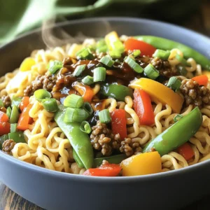 - 1 lb ground beef - 8 oz egg noodles - 1 tablespoon vegetable oil - 2 cloves garlic, minced - 1 inch ginger, minced - 1 small bell pepper, thinly sliced - 1 small onion, thinly sliced - 1 cup snow peas - 1/2 cup scallions, chopped - 1/4 cup soy sauce - 2 tablespoons hoisin sauce - 1 tablespoon sesame oil - 1 tablespoon brown sugar - 1 teaspoon crushed red pepper flakes (optional) Mongolian ground beef noodles are packed with flavor and fun. To start, you need some main ingredients. Ground beef serves as the heart of this dish. Next, egg noodles provide a great base. A splash of vegetable oil helps cook the beef perfectly. Aromatics add depth. Garlic and ginger bring warmth and spice. Bell pepper and onion add sweetness and crunch. Snow peas give a nice pop of color and texture. Finally, scallions add a fresh finish. Now let’s talk about the sauces. Soy sauce and hoisin sauce create a rich, savory flavor. Brown sugar balances the saltiness with a touch of sweetness. You can add red pepper flakes for heat. If you prefer a milder taste, leave them out. These ingredients come together to create a meal you will enjoy. If you want to dive into the full recipe, check out the Full Recipe. 1. Boiling the egg noodles: Fill a large pot with water and bring it to a boil. Add a pinch of salt for flavor. Once the water is boiling, toss in the egg noodles. Cook them according to the package instructions until they are al dente. This usually takes about 5-7 minutes. 2. Draining and setting aside: After cooking, carefully drain the noodles in a colander. Rinse them briefly under cold water to stop the cooking process. Set them aside while you prepare the beef. 1. Heating the oil in the skillet: Grab a large skillet or wok and place it on medium-high heat. Add one tablespoon of vegetable oil and let it heat up. You want the oil to shimmer but not smoke. 2. Browning the ground beef: Add one pound of ground beef to the hot skillet. Use a spatula to break it apart as it cooks. Brown the meat for about 5-7 minutes until it's fully cooked. Drain any excess fat to keep the dish light. 1. Adding garlic and ginger: Once the beef is browned, stir in two minced cloves of garlic and one inch of minced ginger. Cook this mixture for about one minute until it smells amazing. 2. Stir-frying with bell pepper and snow peas: Now, toss in one small sliced bell pepper, one small sliced onion, and one cup of snow peas. Stir-fry everything together for 3-5 minutes until the vegetables are tender but still crisp. 1. Mixing soy sauce, hoisin sauce, and other ingredients: In a small bowl, mix together 1/4 cup of soy sauce, 2 tablespoons of hoisin sauce, 1 tablespoon of sesame oil, and 1 tablespoon of brown sugar. If you like a kick, add 1 teaspoon of crushed red pepper flakes. Stir well until combined. 1. Pouring sauce over beef and veggies: Pour the sauce over the beef and vegetable mixture in the skillet. Stir well to coat everything evenly. 2. Tossing in the cooked noodles: Finally, add the drained egg noodles to the skillet. Gently toss everything together until the noodles are well mixed with the beef and veggies. 1. Adjusting with salt and pepper: Taste your dish and add salt and pepper as needed. This step ensures every bite is delicious. 2. Garnishing with scallions: Just before serving, sprinkle 1/2 cup of chopped scallions over the top. This adds a fresh touch and a pop of color to your meal. You now have a delicious plate of Mongolian Ground Beef Noodles ready to enjoy. For the full recipe, refer back to the instructions above. Fresh ingredients make all the difference. Use quality ground beef, fresh garlic, and ginger. These add a rich taste. Choose vibrant bell peppers and crisp snow peas. They enhance the dish's color and crunch. For cooking techniques, I recommend stir-frying. This method keeps veggies crisp and retains flavor. Heat your pan well before adding ingredients. This helps achieve a nice sear on the beef. Want to change the heat level? You can easily modify red pepper flakes. Start with less if you prefer milder food. You can always add more later. If you want alternatives, try Sriracha or chili paste. These add heat and flavor. You can also use sweet spices like paprika for a different taste. Batch cooking is a great idea. Make a large batch of Mongolian ground beef noodles. Store in airtight containers. This saves time on busy days. For reheating, use the stove for best results. Add a splash of water to keep it moist. Microwaving is quick, but it may dry out the noodles. For the full recipe, check out the details I provided earlier. {{image_2}} You can easily swap out the ground beef for other proteins. Chicken works well and cooks fast. Tofu is a great choice for a vegetarian meal. Both options bring unique flavors to your dish. For veggies, feel free to mix things up. Broccoli, carrots, or bok choy add color and taste. You can use whatever you have on hand. The key is to balance textures and flavors in your bowl. If you need gluten-free options, use rice noodles instead of egg noodles. They cook quickly and still taste great. Check your soy sauce too. Look for gluten-free varieties to stay safe. For a vegan version, choose tofu and skip the beef. Replace egg noodles with rice noodles. Use vegetable broth instead of soy sauce for a deeper flavor. These swaps keep your meal hearty and satisfying. Pair your Mongolian ground beef noodles with simple sides. Steamed rice or a fresh salad works well. For drinks, try green tea or a light beer. These choices enhance the meal without overpowering it. For presentation, serve in large bowls. Top with extra scallions for color. A sprinkle of sesame seeds adds crunch and style. Making the meal look appealing makes it even more enjoyable! For the complete recipe, check out the Full Recipe section above. To keep your Mongolian ground beef noodles fresh, use airtight containers. Glass or plastic containers work well. Be sure to let the noodles cool down before sealing them. Store leftovers in the fridge for up to three days. This way, you can enjoy your tasty meal again! If you want to save some for later, freezing is a great option. First, let the dish cool completely. Then, place it in freezer-safe containers. You can also use heavy-duty freezer bags. When you’re ready to eat, take it out and thaw it in the fridge overnight. For reheating, warm it up in a skillet over low heat. This helps keep the flavors fresh. Always check your leftovers before eating. Look for any off smells or changes in color. If the noodles feel slimy or sticky, it’s best to throw them away. When in doubt, don’t eat it! Food safety is important for your health. Mongolian ground beef noodles are a tasty dish made with ground beef and egg noodles. This dish has roots in Asian cuisine, often inspired by Mongolian flavors. It blends savory sauces with fresh vegetables, creating a warm and filling meal. It's a quick and easy recipe perfect for busy weeknights. Yes, you can make this recipe in advance. Prepare the ground beef and noodles ahead of time. Store them separately in airtight containers in the fridge. You can also cook the full dish and reheat it later. Just add a little water when reheating to keep it moist. You can easily customize this recipe to fit your diet. Here are some ideas: - Use ground turkey or chicken instead of beef. - Swap egg noodles for rice noodles to make it gluten-free. - Add any vegetables you like, such as broccoli or carrots. - For a vegan option, use tofu and vegetable broth. The spice level can vary. This recipe includes crushed red pepper flakes, which add heat. You can skip them or reduce the amount for less spice. If you enjoy heat, feel free to add more! Serve Mongolian ground beef noodles hot, straight from the pan. You can garnish them with chopped scallions for a fresh touch. Pair this dish with steamed vegetables or a light salad. It works well with cold drinks like iced tea or lemonade. For the full recipe, check out the details in the earlier sections. Mongolian ground beef noodles are simple, tasty, and rewarding to make. We explored the key ingredients, steps, and tips to achieve great flavor. You can customize the dish to fit different diets and swap in favorite proteins or veggies. Meal prep tips help you enjoy this dish anytime. With the right techniques, your noodles will shine. Experiment and enjoy your cooking journey. Transform this dish to suit your taste and impress everyone at the table.