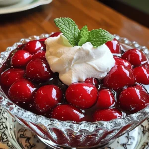 Classic Cherry Delight needs simple ingredients for a tasty treat. This recipe features fresh cherries, sugar, and cornstarch. These basic items combine to create a sweet and smooth dessert. You also need lemon juice, vanilla extract, and water for flavor and texture. Butter adds richness, while whipped cream tops off the dish for a creamy finish. Finally, mint leaves bring a pop of color and freshness. Fresh ingredients make all the difference in this recipe. I always choose ripe cherries that are sweet and juicy. Pitting and halving them keeps the texture right. Using fresh lemon juice brightens the flavor. Vanilla extract should be pure for the best taste. When you use these fresh ingredients, you create a delightful and vibrant dessert. You can easily swap some ingredients if needed. If you can’t find fresh cherries, use frozen ones. Just thaw and drain them first. For sugar, try brown sugar for a deeper flavor. If you need a gluten-free option, cornstarch works perfectly. You can leave out butter if you want a lighter version. These substitutions still keep the dessert delicious and satisfying. First, gather your ingredients. You need fresh cherries, sugar, cornstarch, lemon juice, and water. Start by washing the cherries. Remove the pits and slice them in half. In a medium saucepan, add the cherries, sugar, cornstarch, lemon juice, and water. Mix it all well. This ensures the cherries get coated evenly. Now, it's time to cook. Place the saucepan over medium heat. Stir the mixture occasionally. You want it to come to a gentle boil. This should take about 5-7 minutes. Once it boils, reduce the heat. Let it simmer for an additional 3-5 minutes. The mixture will thicken, and the cherries will soften. This step is key, as it brings out the cherry flavor. After cooking, remove the saucepan from heat. Stir in the vanilla extract and butter. This adds a rich flavor to the cherries. Let the mixture cool slightly. Then, transfer it to a serving dish or individual bowls. Chill in the refrigerator for at least 1 hour. When ready to serve, top it with whipped cream and garnish with mint leaves. Enjoy this tasty treat! For the complete recipe, check the Full Recipe section. When picking cherries, look for bright colors. The cherries should feel firm and plump. Avoid any with bruises or soft spots. Fresh cherries taste best in this recipe. If you can, buy them in season. This usually means late spring to early summer. Local markets often have the freshest options. One common mistake is using sour cherries. These will not taste sweet enough. Always stick to sweet varieties for this dessert. Another mistake is not pitting the cherries well. Leaving pits can ruin the dish's texture. Lastly, don’t skip chilling the dessert. This step helps the flavors meld beautifully. Add a splash of almond extract for a nutty twist. This small change can elevate the dish. A hint of cinnamon can also add warmth. If you want a tart kick, try more lemon juice. Fresh herbs like basil can create a surprising flavor. You can also swap the whipped cream for vanilla ice cream for a different texture. For the full recipe, check the details above. Enjoy making this delicious treat! {{image_2}} You can mix chocolate with Classic Cherry Delight to create a rich treat. Start by melting dark chocolate or milk chocolate. After cooking your cherry mixture, stir in the melted chocolate. It adds a smooth, sweet layer to the tart cherries. This version is perfect for chocolate lovers! Feel free to add other fruits for a fun twist. Try using blueberries, strawberries, or raspberries. These fruits can give your dessert a new flavor and color. Simply mix them in with the cherries at the start. You can also layer them on top when serving for a pretty look. You can serve Classic Cherry Delight in many ways. Instead of a bowl, use a pie crust for a cherry pie effect. You can also layer the cherry mixture and whipped cream in a glass for a fun parfait. Another idea is to use it as a topping for ice cream or pancakes. Each option makes your treat even more exciting! For the full recipe, check back to see how to make this classic dish shine. To keep your Classic Cherry Delight fresh, store it in an airtight container. Make sure to seal it well to prevent air from getting in. This helps keep the flavors bright and the texture just right. You can store it in the fridge for up to three days. If you notice any changes in color or smell, it's best to toss it. If you want to enjoy your leftovers, you can gently reheat them. Place the cherry delight in a saucepan over low heat. Stir often to avoid burning. You can also add a splash of water to help regain moisture. Heat until warm but not boiling. If you prefer it cold, just give it a quick stir and serve it again. Freezing Classic Cherry Delight is a great option if you want to save some for later. To do this, place it in a freezer-safe container. Leave some space at the top, as the mixture will expand when frozen. It can last up to two months in the freezer. When you're ready to eat it, move it to the fridge to thaw overnight. For the best taste, enjoy it within a week after thawing. Classic Cherry Delight is a sweet, fruity dessert. It features fresh cherries in a thick sauce. The sauce blends sugar, cornstarch, and lemon juice. This dish is chilled and served with whipped cream. The bright color and sweet taste make it a favorite. Yes, you can make Classic Cherry Delight ahead of time. Prepare it a day before your event. Just store it in the fridge. This allows the flavors to blend well. Chilling also helps the dessert set properly. To make Classic Cherry Delight more indulgent, consider adding chocolate. You can drizzle melted chocolate over the whipped cream. Another option is to use cream cheese in the whipped cream. This gives a rich texture and flavor. You could also top it with crushed nuts for a crunch. For the full recipe, check out the details above. This blog post explored the key elements of making Classic Cherry Delight. We discussed the best fresh ingredients, cooking steps, and tips to boost flavor. I shared variations to try and storage tips to keep your dessert fresh. Classic Cherry Delight can be fun and easy. With careful selection and simple steps, you can create a delightful treat. Keep experimenting with flavors and have fun making your own version!