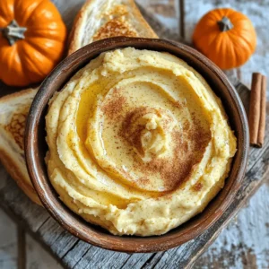 - 1 cup unsalted butter, softened - 1/2 cup pumpkin puree (canned or fresh) - 1/4 cup honey - 1 teaspoon vanilla extract - 1 teaspoon pumpkin spice blend - 1/4 teaspoon salt These simple ingredients create a tasty treat. Unsalted butter gives a rich base. Pumpkin puree adds a silky texture and flavor. Honey sweetens this spread naturally. Vanilla extract brings warmth and depth. The pumpkin spice blend gives that cozy, fall taste. Finally, salt balances all the sweet and spicy notes. - Alternatives for unsalted butter: You can use salted butter if you like a touch of salt. For a dairy-free option, try coconut oil or a vegan butter brand. - Using different sweeteners instead of honey: Maple syrup works well if you want a different sweet flavor. Agave syrup is another good choice for a milder sweetness. - Fresh vs. canned pumpkin puree: Canned pumpkin is easy and convenient. Fresh pumpkin can offer a brighter taste, but it requires more prep. Either works great in this recipe! Creating whipped pumpkin spice honey butter is fun and easy. You can find the full recipe in the article above. Let your creativity shine as you mix it up with these options! To start, gather your mixing bowl and a hand mixer or stand mixer. Make sure your butter is softened. It should feel like a gentle squeeze when you press it. This step is key for a fluffy texture. If the butter is too cold, it won’t whip well. Begin by placing the softened butter in the mixing bowl. Beat the butter for about 2-3 minutes until it looks light and fluffy. This step adds air and makes it smooth. Next, add the pumpkin puree, honey, vanilla extract, pumpkin spice blend, and salt. Mix everything on medium speed for another 2-3 minutes. You want it to be creamy and well combined. Now, taste your butter. If it needs more sweetness, add a bit more honey. Mix briefly to blend it in. Once it’s just right, transfer your whipped pumpkin spice honey butter into a jar. Seal it tightly and refrigerate it. This can last up to 2 weeks. You can find the Full Recipe for more details. To make your whipped pumpkin spice honey butter smooth, start by softening your butter. Let it sit at room temperature for about 30 minutes. You want it soft but not melted. If you are short on time, cut the butter into small pieces. This helps it soften faster. When mixing, use a hand mixer or stand mixer. Start on low speed to avoid splatters. Gradually increase the speed until your butter is light and fluffy. This should take about 2-3 minutes. The key here is patience; take your time to whip it well. To make your butter even more special, think about adding extra spices. A pinch of nutmeg or a dash of clove can elevate the flavor. You can also try adding a bit of maple syrup for a unique twist. Just be careful not to overdo it; you want to keep the pumpkin flavor front and center. If you like it sweeter, add more honey. Mix it in slowly, tasting as you go. You want a balance where the sweetness enhances the pumpkin, not overpowers it. Whipped pumpkin spice honey butter pairs wonderfully with many foods. Spread it on warm toast, bagels, or pancakes for a delightful breakfast. It also works great on muffins or scones. For a creative touch, use it in your fall recipes. Try it on sweet potato dishes or even as a topping for warm desserts. The flavors mesh beautifully with seasonal favorites. This butter is not just a spread; it’s a way to add joy to your meals! {{image_2}} You can easily change the flavor of your whipped pumpkin spice honey butter. Here are a couple of ideas: - Adding maple syrup for a unique touch: Maple syrup adds a sweet and earthy note. Mix in about 1/4 cup of maple syrup when you add the honey. This gives your butter a rich flavor and a lovely twist. - Incorporating citrus zest for brightness: Try adding a teaspoon of orange or lemon zest. This brightens the flavor and adds freshness. The citrus will balance the sweetness of the honey and pumpkin. If you have dietary needs, there are easy swaps: - Dairy-free alternatives for butter: Use coconut oil or a dairy-free butter substitute. This keeps the texture but makes it vegan-friendly. - Vegan honey options: Instead of honey, use agave nectar or maple syrup. Both options work well for a sweet touch without animal products. You can make your whipped pumpkin spice honey butter even more special with seasonal ideas: - Holiday-inspired twists: Add nutmeg or cloves for a festive flavor. You can also mix in dried cranberries for a fun texture and color. - Using local or artisanal ingredients: Find local honey or fresh spices. This enhances the taste and supports local farms. Plus, it makes your butter unique and special. Feel free to explore these variations to create your perfect whipped pumpkin spice honey butter! To keep whipped pumpkin spice honey butter fresh, always store it in an airtight container. This helps prevent it from absorbing any odors from your fridge. A glass jar works great, as it seals tightly and looks nice on your table. Make sure to scoop out the butter with a clean knife to avoid contamination. This keeps your butter tasty and safe to eat. Whipped pumpkin spice honey butter lasts about two weeks in the fridge. Keep an eye on it for any signs of spoilage. If you want to store it longer, freezing is a great option. To freeze, spoon the butter into a freezer-safe container. Leave some space at the top, as it will expand. You can also make small portions in ice cube trays for easy use later. Just thaw what you need in the fridge overnight. Enjoy the flavors of fall anytime! How to make whipped pumpkin spice honey butter simpler? You can make this butter simpler by using fewer steps. Combine all ingredients in one bowl at once. Mix until smooth. This method saves time while keeping the flavor. Can I use other sweeteners instead of honey? Yes, you can use maple syrup or agave nectar. Each sweetener adds a different flavor. Adjust the amount to taste. Experiment to find your favorite. What are the health benefits of using pumpkin in recipes? Pumpkin is low in calories and high in fiber. It offers vitamins A and C, which boost immune health. The antioxidants in pumpkins support good vision and skin health. How to use the butter beyond breakfast? Use this butter on muffins, scones, or pancakes. It also works well in savory dishes. Spread it on roasted veggies or use it in sandwiches for a tasty twist. Best ways to show off the butter when entertaining? Serve in a pretty dish with warm bread or crackers. Add a small pumpkin or cinnamon stick for decoration. This makes your spread look inviting and festive. What can I serve with pumpkin spice honey butter? Pair it with toast, bagels, or pancakes. It enhances the flavor of waffles or baked goods. You can also use it as a dip for fruit. How do I store leftover whipped butter? Store it in an airtight container in the fridge. It stays fresh for up to two weeks. You can also freeze it for longer storage. Just thaw before using. This blog post covers how to make whipped pumpkin spice honey butter. We discussed the key ingredients, including easy substitutes. You learned step-by-step instructions for mixing and creating the perfect texture. I shared tips for flavor and storage to keep your butter fresh. In conclusion, this recipe is fun and simple. You can customize it to suit your tastes. Enjoy making and sharing this delicious butter with friends and family!