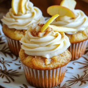 - 1 cup all-purpose flour - 1/2 cup granulated sugar - 1 teaspoon baking powder - 1/2 teaspoon baking soda - 1/4 teaspoon salt - 1 teaspoon ground cinnamon - 1/2 cup unsalted butter, melted - 1 large egg - 1/2 cup buttermilk (or alternative) - 1 cup peeled and diced apples (e.g., Granny Smith or Honeycrisp) - 1/2 cup brown sugar - 1 tablespoon ground cinnamon - 1/4 cup chopped walnuts (optional) - 1/2 cup cream cheese, softened - 1/4 cup powdered sugar - Muffin tin - Cupcake liners - Mixing bowls - Whisk and spatula - Electric mixer (for frosting) This recipe packs all the cozy flavors of apple pie into a cupcake format. You will love the tender cake, sweet apples, and creamy frosting. This recipe serves 12 cupcakes. When you gather all these ingredients, you set the stage for a delightful baking experience. Each item plays a role, from the apples giving freshness to the cinnamon adding warmth. The tools ensure a smooth process, making it easy to whip up these treats. Now, let's dive into the steps to create these apple cinnamon roll cupcakes! 1. Preheat the oven to 350°F (175°C). Line a muffin tin with cupcake liners. This helps with easy removal after baking. 2. In a large bowl, mix the dry ingredients. Combine 1 cup of all-purpose flour, 1/2 cup of granulated sugar, 1 teaspoon of baking powder, 1/2 teaspoon of baking soda, 1/4 teaspoon of salt, and 1 teaspoon of ground cinnamon. Whisk until everything is well blended. 3. In another bowl, combine the wet ingredients. Mix 1/2 cup of melted unsalted butter, 1 large egg, and 1/2 cup of buttermilk. Stir until smooth and creamy. 1. Pour the wet mixture into the dry ingredients. Stir gently until just combined. Be careful not to overmix; this keeps the cupcakes light. 2. Now, fold in 1 cup of peeled and diced apples and 1/4 cup of chopped walnuts if you like. Make sure they are evenly spread throughout the batter. 1. Spoon half of the batter into each cupcake liner. Fill them about halfway. This gives room for rising. 2. Next, sprinkle about 1 teaspoon of the cinnamon sugar filling (made from 1/2 cup of brown sugar and 1 tablespoon of ground cinnamon) on top of the batter in each liner. Then, cover with the remaining batter. 3. Finally, sprinkle the rest of the cinnamon sugar filling on top. Bake for 18-20 minutes. Check with a toothpick; it should come out clean when done. Let the cupcakes cool for 5 minutes in the tin. Then, move them to a wire rack. Enjoy the delightful aroma that fills your kitchen while they bake. For the full recipe, check out the detailed instructions above. To get soft and moist cupcakes, do not overmix your batter. When you combine the wet and dry ingredients, stir gently until just mixed. Overmixing makes the cupcakes tough. When you fold in the apples, do so with care. Use a spatula and gently lift the batter from the bottom. This keeps the apples intact and helps the texture stay light. For smooth cream cheese frosting, beat the softened cream cheese and powdered sugar well. Start on low speed to avoid splatters, then increase to medium. This makes it creamy and easy to spread. When decorating, use a piping bag for a neat look. You can add swirls or rosettes for style. A sprinkle of cinnamon on top adds a nice touch, too. To boost flavor, consider adding extra spices. A pinch of nutmeg or ginger can elevate your cupcakes. You can also try vanilla or almond extract for a twist. For apple varieties, feel free to mix it up. Honeycrisp apples add sweetness, while Granny Smith offers a tart bite. Each type will bring its own flavor to your cupcakes. For the Full Recipe, refer to the earlier section. Enjoy baking! {{image_2}} You can make these cupcakes healthier with a few easy swaps. Try using whole wheat flour instead of all-purpose flour. This change adds fiber and nutrients. You can also use alternative sweeteners like honey or maple syrup instead of granulated sugar. If you want dairy-free options, use almond milk or coconut milk for the buttermilk. These swaps keep the flavor while making the recipe a bit lighter. Want to mix things up? Add cranberries or raisins to the batter for a burst of flavor. These fruits pair well with apples and add a sweet chewiness. You can also experiment with different nuts. Walnuts add crunch, but pecans or almonds work well too. Each nut gives a unique taste and texture to your cupcakes. Make your cupcakes fit the season! In autumn, add pumpkin spice to the batter for a warm, cozy flavor. This spice mix brings a lovely aroma and taste. During spring or summer, add citrus zest from lemons or oranges for a fresh twist. The citrus brightens the flavor and gives a lively touch to your cupcakes. For the full recipe, check out the notes above. To keep your apple cinnamon roll cupcakes fresh, store them in the pantry or the fridge. In the pantry, put them in an airtight container. This keeps them soft and moist. If you store them in the fridge, they can last longer. Just remember to wrap them well to avoid drying out. If you want to freeze these cupcakes, first let them cool completely. Then, wrap each cupcake in plastic wrap. Finally, place them in a freezer bag. This method keeps them fresh for about three months. When you're ready to enjoy, thaw them in the fridge overnight. Apple cinnamon roll cupcakes can last up to five days in the pantry. If stored in the fridge, they can last about a week. Look for signs of spoilage like a change in smell or texture. If they become hard or dry, it's best to toss them. To reheat your cupcakes without drying them out, use a microwave. Heat them for about 10-15 seconds. This warms them gently without making them tough. You can also use an oven for a crispy top. Set it to 350°F and heat for about five minutes. Enjoy your cupcakes warm and delicious! Yes, you can make these cupcakes ahead of time. To do this, bake them and let them cool completely. Once cooled, store them in an airtight container. They will stay fresh for up to three days at room temperature. If you want to freeze them, wrap each cupcake in plastic wrap. Place them in a freezer-safe bag. They can last up to three months in the freezer. Before serving, let them thaw at room temperature. You can frost them just before serving for the best taste. Yes, you can use other fruits! Pears work great and add a nice flavor. You can also try diced peaches or berries. Just be aware that some fruits have more water. If you use juicy fruits, reduce the buttermilk slightly. This helps keep the batter from getting too runny. Each fruit brings its own taste, so feel free to experiment! If you're looking for something different, try a simple glaze. Mix powdered sugar with milk until smooth. Drizzle it over the cupcakes for a sweet finish. You can also use whipped cream for a lighter touch. A sprinkle of cinnamon sugar on top adds extra flavor. If you want a fun twist, use caramel sauce for drizzling. Each option makes these cupcakes even more fun! Yes, you can make these cupcakes vegan! Use plant-based butter instead of regular butter. For the egg, try a flaxseed egg. Mix one tablespoon of ground flaxseed with three tablespoons of water. Let it sit for five minutes to thicken. Replace buttermilk with plant milk mixed with vinegar, just like the recipe suggests. With these swaps, you can enjoy tasty vegan apple cinnamon roll cupcakes! This blog covered all you need for perfect apple cinnamon roll cupcakes. We discussed essential ingredients, key tools, and a full recipe guide to help you succeed. Tips for texture and frosting techniques made the process smoother. You also learned fun variations and storage methods to keep your cupcakes fresh. Try out different fruits or healthier options to make it your own. Happy baking! Enjoy your delicious treats!