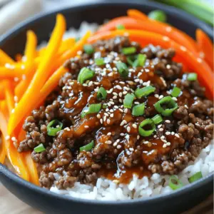 - 1 lb ground beef (or diced beef) - 1 tablespoon vegetable oil - 3 cloves garlic, minced - 1 tablespoon ginger, minced - 2 tablespoons soy sauce - 1 tablespoon gochujang (Korean chili paste) - 1 tablespoon sesame oil - 2 tablespoons brown sugar - 1 carrot, julienned - 1 bell pepper, sliced (red or yellow) - 2 green onions, chopped - Sesame seeds for garnish Gather these ingredients before you start. The beef gives the dish its heartiness. Garlic and ginger add depth. The sauce brings the heat and sweetness. You can adjust these to fit your taste. The veggies add crunch and color. Don't skip the sesame seeds; they add a nice touch. - Heat the skillet and sauté garlic and ginger. - Cook the ground beef until browned. First, grab a large skillet and turn the heat to medium-high. Add one tablespoon of vegetable oil. Once the oil is hot, toss in three cloves of minced garlic and one tablespoon of minced ginger. Sauté them for about 30 seconds. You want to smell that wonderful aroma! Next, add one pound of ground beef. Break it apart with a spatula. Cook it for about 5-7 minutes until it turns brown. This step is key to building flavor. - Whisk together soy sauce, gochujang, sesame oil, and brown sugar. - Pour the sauce over the cooked beef. In a small bowl, mix together two tablespoons of soy sauce, one tablespoon of gochujang, one tablespoon of sesame oil, and two tablespoons of brown sugar. Use a whisk to blend them well. When the beef is ready, pour this sauce over it. Stir to coat all the beef evenly. Let it simmer for about 2-3 minutes to soak in the flavors. - Stir in the julienned carrot and sliced bell pepper. - Cook until the veggies are tender but still crisp. Now, it’s time to add some color! Stir in one julienned carrot and one sliced bell pepper. I like using red or yellow bell peppers for their sweetness. Cook for another 2-3 minutes. You want the veggies to be tender but still have that nice crunch. This gives the bowl great texture! To make your Spicy Korean Beef Bowls just right, adjust the gochujang. If you like it spicier, add more. If you prefer it mild, use less. Gochujang gives the dish heat and flavor. Adding more garlic can also enhance the taste. Garlic adds a nice depth to the dish. Use a non-stick skillet for easy cleaning. This helps keep your cooking space tidy. When cooking the beef, do not overcrowd the pan. This allows the beef to brown better and taste great. Browned beef adds a rich flavor to your meal. Get your ingredients ready ahead of time. Chop vegetables and measure sauces before cooking. This makes your cooking process smoother and quicker. You can also use leftover rice. It saves time and makes your meal come together faster. {{image_2}} You can swap the ground beef for ground turkey or chicken. This change keeps the dish light. If you want more heat, replace gochujang with sriracha. Sriracha adds a nice kick without losing flavor. Serve your beef bowls with steamed broccoli or bok choy for a fresh touch. Both veggies add nutrients and color. For a lighter option, try the beef over a salad. This makes a great meal for warm days. If you need gluten-free options, look for gluten-free soy sauce. It offers the same salty flavor. For vegan alternatives, use plant-based meat. This way, you still enjoy the dish without meat. Store your spicy Korean beef bowls in airtight containers. This keeps the dish fresh and tasty. You can use glass or plastic containers. Make sure they seal well. Leftovers can last about three to four days in the fridge. Always cool the dish before storing it. This helps keep the texture right. You can freeze the beef bowls for longer storage. Portion the beef and rice into separate containers. This way, you can heat only what you need. Use freezer-safe bags or containers. Label each with the date. For thawing, place the container in the fridge overnight. Reheat on the stove or in the microwave. Make sure it’s heated all the way through. For best freshness, eat the dish within four days if refrigerated. When frozen, it can last up to three months. Look for signs of spoilage. If the color changes or there’s an off smell, it’s time to toss it. Always trust your senses when checking food. This ensures you enjoy every bite safely. To make Spicy Korean Beef Bowls less spicy, you can adjust the gochujang. Start with half of the amount and taste as you go. You can also add more brown sugar to balance the heat. Another great tip is to add more veggies like carrots and bell peppers. These will add sweetness and flavor without the spice. Milk or yogurt on the side can help cool your mouth, too. You can serve Spicy Korean Beef Bowls with several tasty sides. Steamed broccoli or bok choy adds a nice crunch. You could also serve it with a simple cucumber salad for freshness. Another option is kimchi, which adds tang and flavor. If you want a lighter meal, try serving it over a bed of leafy greens. Yes, you can prepare this recipe in advance. Cook the beef and veggies, then store them in the fridge. They will stay fresh for about three days. To reheat, simply warm everything in a skillet. You can also microwave it if you're short on time. Just make sure to heat it until it is hot all the way through. The total time to cook Spicy Korean Beef Bowls is about 25 minutes. You will spend about 15 minutes prepping the ingredients. Cooking takes another 10 minutes, making it a quick meal. This is perfect for busy weeknights or when you need a tasty dish fast. This blog post detailed how to make delicious Spicy Korean Beef Bowls. You learned about the main ingredients and easy steps for preparation. I shared tips for adjusting spice levels and cooking smarter. You can explore variations, substitutions, and serving ideas. As you cook, remember to have fun and make it your own. Enjoy your meal and impress your friends and family with this tasty dish!