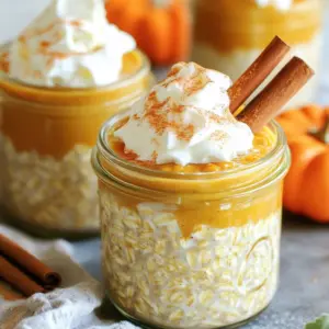 To make these delicious oats, you need a few key items: - 1 cup rolled oats - 1 cup almond milk (or any milk of choice) - 1/2 cup canned pumpkin puree - 1 tablespoon maple syrup (or honey) - 1 teaspoon pumpkin pie spice - 1/2 teaspoon vanilla extract - A pinch of salt These ingredients create a creamy, flavorful base. The rolled oats soak up the milk and flavors. Pumpkin puree adds rich texture and taste. Maple syrup brings sweetness, while pumpkin pie spice gives that cozy fall flavor. You can add a few optional items to make your oats even better: - 2 tablespoons chia seeds (for extra thickness) - Whipped cream (for garnish) - Cinnamon stick (for garnish) Chia seeds boost nutrition and add a nice texture. Whipped cream makes it feel special. A cinnamon stick adds a pretty touch and more flavor. You can easily swap ingredients to fit your needs: - Use coconut milk for a richer taste. - Swap maple syrup for agave syrup if needed. - Use oat milk or soy milk for a dairy-free option. These swaps keep the dish flavorful and fun. You can enjoy it no matter your diet. Start by taking a large mixing bowl. In the bowl, combine these ingredients: - 1 cup rolled oats - 1 cup almond milk (or your milk of choice) - 1/2 cup canned pumpkin puree - 1 tablespoon maple syrup (or honey) - 1 teaspoon pumpkin pie spice - 1/2 teaspoon vanilla extract - A pinch of salt If you want extra thickness, add 2 tablespoons of chia seeds. Mix well until all ingredients blend together. The pumpkin puree gives a nice creamy texture. The spices will fill your kitchen with a warm, cozy smell. Once your mixture is ready, it’s time to portion it out. Divide the oat mix evenly into two airtight jars or containers. Make sure they have lids. Seal the jars tightly. Place them in the refrigerator. Let the oats chill for at least 4 hours, but overnight is best. This allows the oats to soak up the flavors and become soft. In the morning, take your jars out of the fridge. Stir the oats to mix any settled ingredients. You can eat them cold or warm them up slightly. For a fun touch, top the oats with whipped cream. A sprinkle of cinnamon or an extra dash of pumpkin pie spice adds flavor. You can even add a cinnamon stick for decoration. Enjoy your cozy, delicious oats! To get creamy oats, use rolled oats instead of quick oats. Rolled oats soak up liquid well. Make sure to use enough almond milk. One cup is ideal. Adding chia seeds helps too. They absorb liquid and make the oats thicker. Stir the mixture well to ensure all oats are moist. Let them sit overnight in the fridge. This gives them time to soak up flavors. To boost the pumpkin spice flavor, add more pumpkin pie spice. One teaspoon is a great start. If you love a stronger taste, try 1.5 teaspoons. You can also add a little nutmeg or ginger. These spices make the oats taste warm and cozy. A splash of vanilla extract adds sweetness too. You can even mix in extra pumpkin puree for a richer flavor. Making these oats ahead is simple. Prepare them the night before. This saves time in the morning. Use airtight jars to keep them fresh. You can make a batch for the week. Just double the recipe to make four servings. Store them in the fridge for up to five days. In the morning, grab a jar, stir, and enjoy! {{image_2}} To make your Pumpkin Spice Latte Overnight Oats dairy-free, simply use almond milk or any plant-based milk. You can also swap honey for maple syrup to keep it vegan. This way, everyone can enjoy the creamy goodness without dairy. Try adding different spices to change the flavor. You can mix in nutmeg or allspice for a warm twist. For a chocolatey flavor, stir in cocoa powder. If you want a fruit kick, add bananas or apples. Each choice brings a new taste adventure. Toppings can make your oats even better! Add whipped cream for a creamy finish. A sprinkle of cinnamon or extra pumpkin pie spice gives a festive touch. You can also use nuts, granola, or dried fruit for crunch. A cinnamon stick not only looks nice but also adds flavor. To keep your pumpkin spice latte overnight oats fresh, use airtight jars. After mixing, divide the oats into two jars. Seal them tightly to keep air out. This method helps retain flavor and texture. It makes it easy to grab and go in the morning. Your overnight oats will stay good in the fridge for up to five days. This means you can prepare them ahead of time. Enjoying them all week is simple and saves you time. Just remember to check for any changes in smell or texture before eating. If you want to store your oats for longer, freezing is a great option. Use freezer-safe containers or jars. Just make sure to leave some space at the top. The oats expand as they freeze. They can last up to three months in the freezer. When you’re ready to eat, thaw them in the fridge overnight. Yes, you can use quick oats. Quick oats cook faster and absorb liquid quickly. Your overnight oats will be softer. If you like a chewier texture, stick with rolled oats. To make your oats dairy-free, use almond milk or any plant-based milk. Options include oat milk, soy milk, or coconut milk. These choices keep the flavor rich and creamy while being dairy-free. Chia seeds add extra thickness and fiber. They are high in omega-3 fatty acids. These seeds can help keep you full and boost heart health. Adding chia seeds makes your oats even more nutritious. Absolutely! Just double each ingredient and follow the same steps. This way, you can have four servings ready. Meal prepping saves time on busy mornings. You can keep leftover oats for up to five days. Store them in airtight containers. Always check for freshness before eating, especially if you add toppings. You learned how to make pumpkin spice latte overnight oats. We covered key ingredients, along with fun ways to customize them. With step-by-step instructions, you can whip these up easily. Tips helped ensure your oats are creamy and full of flavor. Various options let you enjoy them dairy-free or with different toppings. Think of these oats as an easy breakfast to fuel your day. Enjoy experimenting and making them your own!