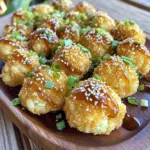 - 1 medium head of cauliflower, cut into bite-sized florets - 1 cup all-purpose flour - 1 cup panko breadcrumbs - 1 cup coconut milk - 1 teaspoon garlic powder - 1 teaspoon onion powder - 1 teaspoon smoked paprika - 1 teaspoon salt - 1/2 teaspoon black pepper The main ingredients create a tasty base for the bites. The cauliflower gives a great texture. All-purpose flour helps the batter stick, and panko adds crunch. Coconut milk makes the batter creamy and rich. The spices bring flavor and depth to every bite. - 2 tablespoons soy sauce (or tamari) - 2 tablespoons sesame oil - 1 tablespoon maple syrup - 1 tablespoon rice vinegar - 1 tablespoon sesame seeds, toasted The sauce adds a sweet and savory kick. Soy sauce gives umami, while sesame oil brings warmth. Maple syrup balances flavors with sweetness. Rice vinegar adds a tangy note, and toasted sesame seeds give a nutty crunch. - 2 green onions, chopped - Toasted sesame seeds Garnishes enhance both look and taste. Chopped green onions add freshness and color. Extra toasted sesame seeds provide crunch and flavor. Together, they make the dish pop and look appealing on the plate. - Preheat your oven to 425°F (220°C). - Line a baking sheet with parchment paper. This helps prevent sticking and makes cleanup easy. - In a large bowl, combine 1 cup of all-purpose flour, 1 teaspoon of garlic powder, 1 teaspoon of onion powder, 1 teaspoon of smoked paprika, 1 teaspoon of salt, and 1/2 teaspoon of black pepper. - Gradually whisk in 1 cup of coconut milk until it forms a smooth batter. This batter will help the coating stick. - Take each cauliflower floret and dip it into the batter. Make sure to let any excess batter drip off. - Next, coat the floret with 1 cup of panko breadcrumbs. Press gently to ensure they stick well. - Place the coated cauliflower bites on the lined baking sheet. - Lightly drizzle them with 2 tablespoons of sesame oil. This adds flavor and helps them crisp up. - Bake for 25-30 minutes until golden brown. Flip them halfway through for even cooking. - In a small saucepan, whisk together 2 tablespoons of soy sauce, 2 tablespoons of sesame oil, 1 tablespoon of maple syrup, and 1 tablespoon of rice vinegar. - Heat this mixture on low until it warms up, stirring often. This sauce brings all the flavors together. - Once the cauliflower bites are done, place them in a large bowl. - Drizzle the warm sauce over the bites and toss gently to coat each piece. - Serve them on a platter, garnished with toasted sesame seeds and chopped green onions. This adds a nice crunch and fresh flavor. To make your cauliflower bites extra crispy, focus on two main steps. First, ensure your oven is preheated to 425°F (220°C). This high heat helps create that perfect crunch. Second, use panko breadcrumbs, as they are light and airy. If you want an alternative to frying, air frying is a great option. It gives a nice crunch without the extra oil. You can add spice to your bites by mixing in some cayenne pepper or chili flakes. For a different twist, try adding some curry powder or smoked paprika. These spices will kick up the flavor. When it comes to dipping sauces, a sweet chili sauce pairs well with these bites. You can also try a tangy yogurt sauce for a cooling effect. Serve your crispy cauliflower bites with some fresh veggies or a light salad. They make a great snack or appetizer. For parties, arrange the bites on a colorful platter. Garnish with chopped green onions and sesame seeds for a nice touch. This presentation makes them even more appealing and fun to eat. {{image_2}} You can make this dish vegan and gluten-free easily. Start with gluten-free flours like almond or chickpea flour. These add unique flavors and textures. For the sauce, swap soy sauce with tamari. Tamari has a similar taste and is gluten-free. You can also use coconut aminos as a substitute. It adds sweetness and umami without gluten. Cauliflower shines in this recipe, but other veggies work too. Try using broccoli or Brussels sprouts for a twist. Sweet potatoes also make a tasty choice. They add sweetness and pair well with the sauce. For seasonal variations, use carrots in winter or zucchini in summer. Each veggie brings its own flavor. You have options for cooking these bites. Air frying gives them a nice crunch, and it’s faster. Set your air fryer to 400°F and cook for about 15-20 minutes. Baking is classic and easy too. Just follow the original recipe. If you want a smoky flavor, try grilling. Grill the coated cauliflower on skewers for about 10 minutes. It adds a fun taste that everyone will love. To keep your crispy bites fresh, store them in an airtight container. Place a paper towel inside to absorb moisture. This will help the bites stay crispy longer. In the refrigerator, they last about three to four days. For the best texture, reheat the bites in the oven. Set the oven to 375°F (190°C). Place the bites on a baking sheet for about 10 to 15 minutes. This keeps them crispy. If you're in a hurry, you can use the microwave. Heat them for 30 seconds to one minute. The texture won't be as great, but they will still taste good. To freeze the bites, let them cool completely first. Place them in a single layer on a baking sheet and freeze for one hour. Once frozen, transfer them to a freezer-safe bag. They can stay frozen for up to three months. When you're ready to eat, thaw them in the fridge overnight. Then, reheat them in the oven for the best results. Enjoy the same great flavor! Yes, you can use frozen cauliflower. It will save time and effort. Just thaw the florets first. Pat them dry with a towel. This helps remove excess moisture. Moisture can make your bites soggy. You can use the same batter and coating steps as fresh cauliflower. If you want more heat, add chili flakes to the batter. You can also stir in some sriracha to the sauce. Both options will give your bites a nice kick. Adjust the amount based on your spice level. Start with a small amount and taste before adding more. You have a few options for substituting coconut milk. You can use almond milk or soy milk. Both work well and keep the recipe dairy-free. For a creamier option, use heavy cream. If you want a lighter choice, mix water with any milk. To get crispy cauliflower, coat it well with panko breadcrumbs. Press the breadcrumbs onto the florets to help them stick. Baking at a high temperature is key. Make sure to flip the bites halfway through baking. A light drizzle of sesame oil also helps with crispiness. Yes, you can make the sauce ahead of time. Store it in an airtight container in the fridge. It stays fresh for about a week. When ready to use, heat it gently on the stove. Stir it often to avoid burning. This article covered making flavorful cauliflower bites from start to finish. We discussed the key ingredients, step-by-step baking instructions, and helpful tips for the best results. You can also explore variations and storage options to suit your needs. In summary, enjoy experimenting with different flavors and techniques. Cooking should be fun and creative! Keep these methods in mind to impress your friends and family with delicious snacks.