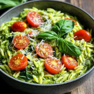 - 1 cup orzo pasta - 2 cups vegetable broth - 1 cup heavy cream Orzo pasta is small and cooks quickly. It absorbs flavors well, making it ideal for this dish. Vegetable broth adds depth and warmth. Heavy cream brings a rich, smooth texture to the mix. - 1/2 cup basil pesto - 1 cup cherry tomatoes, halved - 1 cup fresh spinach Basil pesto infuses a bright, herby taste. It pairs perfectly with the creamy sauce. Cherry tomatoes add sweetness and a pop of color. Fresh spinach wilts down, offering a nice contrast in texture and nutrients. - 1/2 cup grated Parmesan cheese - 2 tablespoons olive oil - 2 cloves garlic, minced - Salt and pepper to taste Grated Parmesan cheese gives a salty kick and enhances creaminess. Olive oil adds richness and helps sauté the garlic. Garlic brings an aromatic touch, while salt and pepper balance all the flavors. Fresh basil leaves are optional but make a lovely garnish. - Heat olive oil and sauté garlic: Start by heating 2 tablespoons of olive oil in a large pot over medium heat. Once hot, add 2 cloves of minced garlic. Sauté for about 1-2 minutes until you smell that great garlic aroma. - Toast orzo pasta: Next, add 1 cup of orzo pasta to the pot. Stir it for another minute. This toasting step adds a nice nutty flavor to the pasta. - Add broth and simmer: Now, pour in 2 cups of vegetable broth. Bring the mixture to a simmer. Allow it to cook for 8-10 minutes. Stir occasionally until the orzo is tender and most of the liquid is absorbed. - Mix in cream and pesto: Reduce the heat to low. Stir in 1 cup of heavy cream and 1/2 cup of basil pesto. Mix well until everything is combined and creamy. - Incorporate vegetables and cheese: Add 1 cup of halved cherry tomatoes and 1 cup of fresh spinach. Cook for an additional 2-3 minutes. You want the spinach to wilt nicely. Then, stir in 1/2 cup of grated Parmesan cheese until it melts into the dish. - Allow flavors to meld: Remove the pot from the heat. Let it sit for a couple of minutes. This helps all those delicious flavors mix together perfectly. - Ensuring perfect orzo texture: To get the best orzo, cook it until it's al dente. This means it should be firm but not hard. Stir often to keep it from sticking together. If it cooks too long, it can turn mushy. - Adjusting thickness of the sauce: If your sauce is too thick, add a splash of vegetable broth or cream. Stir well until it reaches your desired creaminess. For a thicker sauce, let it sit off the heat for a few minutes. - Customizing pesto levels: You can change the amount of pesto to suit your taste. If you love the flavor, add more! Start with a little, then mix and taste. Adjust until it is just right for you. - Alternative cheeses to use: While Parmesan is great, you can try different cheeses. Pecorino Romano offers a sharper flavor. For a creamier touch, use a blend of mozzarella and ricotta. - Presentation ideas for serving: Serve your orzo in deep bowls. Top with fresh basil and a sprinkle of Parmesan for color. Add a drizzle of olive oil for a shiny finish. - Pairing recommendations: This dish pairs well with a light salad or garlic bread. A crisp white wine, like Pinot Grigio, complements the creamy pesto nicely. Enjoy! {{image_2}} You can easily swap the orzo for gluten-free options. Look for gluten-free orzo made from rice or corn. These choices work well and keep the meal tasty. If you want a dairy-free version, use coconut cream or almond milk instead of heavy cream. These alternatives give a creamy texture without dairy. Adding protein can boost your meal. Cooked chicken or shrimp can make it heartier. Simply stir them in after adding the cream and pesto. They warm up nicely. You can also add more veggies. Try bell peppers or zucchini for extra color and flavor. Just chop them small and add them when you mix in the spinach. For a spicy kick, sprinkle red pepper flakes in the pot. This adds heat and fun. Start with a little, and increase to your liking. For a Mediterranean twist, toss in olives and artichokes. Both add a rich flavor and a touch of brininess. They bring new life to the creamy orzo. To keep your One-Pot Creamy Pesto Orzo fresh, store it in the fridge. Place it in an airtight container. This helps keep moisture in and prevents it from drying out. Make sure to let it cool down before sealing. This dish stays good in the fridge for about 3 to 4 days. To reheat your creamy orzo, use the stove for best results. Add a splash of vegetable broth or cream while warming it. This helps bring back the creamy texture. Stir gently as it heats up. If you want more flavor, add extra pesto or cheese during reheating. You can freeze the orzo, but it's best to do this before adding cream. Freeze it for up to 2 months. Use a freezer-safe container to avoid freezer burn. To thaw, place it in the fridge overnight. Reheat it on the stove and mix in heavy cream after thawing. This keeps the dish creamy and delicious. Making One-Pot Creamy Pesto Orzo is quick. The prep time takes about 10 minutes. Cooking time is roughly 20 minutes. In total, you need about 30 minutes. This makes it perfect for a weeknight meal. Yes, you can! To make this dish dairy-free, use coconut cream instead of heavy cream. You can also skip the Parmesan cheese or use a dairy-free cheese. Check labels to ensure the pesto is dairy-free too. This way, everyone can enjoy this creamy delight! You can switch orzo with other pasta shapes. Small shells, ditalini, or even small penne work well. Just keep an eye on the cooking time. Each pasta has a different cooking time, so adjust as needed. This gives you many tasty options for variety! This blog post covered how to make a delicious one-pot creamy pesto orzo. We explored the main ingredients, flavor enhancers, and optional garnishes. You learned step-by-step instructions for cooking and tips to ensure perfect texture. We also looked at variations, storage, and frequently asked questions. In the end, don’t be afraid to customize this dish. It’s a canvas for your creativity, whether with spices or different veggies. Enjoy making it your own!