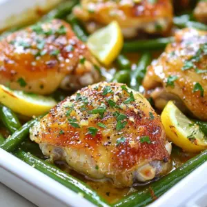 - 4 bone-in chicken thighs, skin-on - 2 tablespoons olive oil - 4 cloves garlic, minced - Zest and juice of 1 large lemon - 2 tablespoons unsalted butter The chicken thighs bring rich flavor and moisture. I love using skin-on thighs. They keep the meat tender and juicy. Olive oil and butter add richness to the dish. Garlic gives a wonderful aroma and taste. Lemon adds brightness and zest, balancing the flavors perfectly. - 1 teaspoon dried oregano - 1 teaspoon paprika - Salt and pepper to taste Dried oregano adds a warm, earthy note. Paprika gives a slight smokiness and color. Salt and pepper are essential for enhancing all the flavors. I recommend tasting the marinade before you add the chicken. Adjust the seasoning to your liking for the best taste. - 300g fresh green beans, trimmed - Fresh parsley, chopped (for garnish) Green beans provide a fresh crunch. Blanching them first keeps their bright color and crispness. The parsley adds a pop of color and freshness when you serve the dish. It&rsquo;s a simple but elegant touch to finish your plate. {{ingredient_image_1}} 1. Preheat your oven to 425&deg;F (220&deg;C) and line a baking sheet with parchment paper. This step is key for easy cleanup. 2. In a small bowl, mix the marinade. Combine 2 tablespoons of olive oil, 4 minced garlic cloves, the zest and juice of 1 large lemon, 1 teaspoon of dried oregano, 1 teaspoon of paprika, and salt and pepper to taste. Stir well. 3. Pat the chicken thighs dry with a paper towel. Place them in a large bowl. Pour the marinade over the chicken. Make sure each thigh is well coated. Let it marinate for at least 15 minutes. If you have time, marinate it longer in the fridge for more flavor. 1. Bring a pot of salted water to a boil. This will help keep the green beans bright and fresh. 2. Add the trimmed green beans to the boiling water. Blanch them for about 2-3 minutes until they turn bright green and are tender-crisp. 3. Once done, drain the green beans and set them aside. This step ensures they will bake nicely with the chicken. 1. Heat a large skillet over medium-high heat. Add the marinated chicken thighs, skin-side down. Sear for 5-7 minutes until the skin is golden brown. This adds a nice crust to the chicken. 2. Flip the thighs and sear for another 3-4 minutes. 3. Transfer the seared chicken to the prepared baking sheet, skin-side up. Arrange the blanched green beans around the chicken thighs. Dot 2 tablespoons of unsalted butter over the green beans. 4. Bake in the preheated oven for 25-30 minutes. Check that the chicken reaches an internal temperature of 165&deg;F (75&deg;C). Toss the green beans halfway through to ensure even cooking. 5. Once finished, remove from the oven and let the chicken rest for 5 minutes. Garnish with fresh chopped parsley before serving. This method gives you juicy chicken thighs paired with crisp green beans, all bursting with flavor. Enjoy your meal! To make the best marinade, let the chicken sit longer. I suggest at least 15 minutes, but longer is better. If you have time, marinate it in the fridge for a few hours. This helps the flavors blend well into the chicken. Adjust the flavors to match your taste. If you love garlic, add more. If you want it zesty, add more lemon juice. Searing chicken skin gets it crispy and golden. Heat your skillet well before adding the chicken. Place the thighs skin-side down and let them cook without moving them. This helps achieve a nice crust. Cook for about 5-7 minutes. Flip the thighs and cook for 3-4 minutes more. Make sure the chicken is cooked through. The internal temperature should reach 165&deg;F (75&deg;C). Garnish your dish with fresh parsley. It adds a pop of color and flavor. When plating, arrange the chicken and green beans nicely. Place the chicken in the center and surround it with green beans. This makes the dish look appealing and ready to eat. A beautiful plate makes the meal more enjoyable. Pro Tips Marinate Longer for Flavor: For an even more flavorful chicken, marinate the thighs for at least 1 hour or overnight in the refrigerator. Use Fresh Herbs: Swap dried oregano for fresh herbs if available. Fresh herbs provide a vibrant flavor that elevates the dish. Check Internal Temperature: Always use a meat thermometer to ensure your chicken reaches 165&deg;F (75&deg;C) for safe consumption. Customize Your Veggies: Feel free to add other vegetables like bell peppers or zucchini along with the green beans for a colorful and nutritious side. {{image_2}} You can easily swap chicken thighs for chicken breasts. Chicken breasts have less fat, so they may cook faster. This change gives you a lighter dish, but keep an eye on the cooking time. You can also try turkey or pork. Turkey thighs are juicy and flavorful, while pork adds a new twist. Each option brings its own taste, so feel free to experiment. If you want to mix up the vegetables, green beans are great, but others work too. Try asparagus, zucchini, or bell peppers. Each brings a different crunch and flavor. Seasonal veggies can also add freshness. In spring, use snap peas or baby carrots. In fall, consider Brussels sprouts or root vegetables. These swaps can keep your meals exciting and colorful. To up the flavor, think about adding new spices or herbs. Thyme or rosemary can give a warm, earthy touch. You could also add a pinch of red pepper flakes for heat. Experimenting with citrus can also change the dish. Try lime or orange juice for a new twist. You can even add olives or capers for a briny kick. These enhancements make your dish unique and delicious. To store leftovers, place the chicken and green beans in an airtight container. Make sure they cool down to room temperature before sealing. This helps keep the meal fresh. When stored properly, your leftovers will stay safe in the fridge for up to three days. If you want to save your meal for later, you can freeze the cooked chicken and green beans. Wrap them tightly in plastic wrap or aluminum foil. Then, place them in a freezer-safe bag. This method helps prevent freezer burn. For best quality, use them within three months. To thaw, move the bag to the fridge overnight. For quick thawing, use the microwave but only if you plan to eat it right away. When reheating, you have two main options: the oven or the microwave. The oven gives a better result. Preheat the oven to 350&deg;F (175&deg;C) and place the chicken and beans on a baking sheet. Heat for about 15-20 minutes, or until warm. This method helps keep the chicken skin crispy. If you use a microwave, heat in short bursts. This helps prevent the chicken from drying out. To check if chicken thighs are fully cooked, use a meat thermometer. Insert it into the thickest part of the thigh. The safe internal temperature for chicken is 165&deg;F (75&deg;C). This ensures it is safe to eat. If you don&rsquo;t have a thermometer, check that the juices run clear, not pink. The meat should no longer look raw. Always make sure to check for doneness, especially with bone-in thighs. Yes, you can use boneless chicken thighs. They cook faster than bone-in thighs. Adjust your cooking time to about 20-25 minutes in the oven. Boneless thighs tend to be more tender. They can also absorb marinade flavors well. Just remember to check the internal temperature to ensure they are fully cooked. Lemon Garlic Chicken Thighs & Green Beans pair well with various sides. Here are some tasty options: - Rice: Plain or lemon-flavored rice complements the dish well. - Mashed Potatoes: Creamy mashed potatoes add a comforting touch. - Salad: A fresh green salad balances the meal with crispness. - Roasted Potatoes: Crispy roasted potatoes are a delicious side. - Bread: Crusty bread is great for soaking up any sauce. Feel free to mix and match sides based on your taste! In this post, we explored how to make Lemon Garlic Chicken Thighs with Green Beans. We covered key ingredients, cooking steps, and handy tips for the best flavor. You learned about variations and food storage to keep your dish fresh. Cooking can be easy and fun. Don't hesitate to try your own twists. Enjoy a delicious meal that impresses everyone around the table!